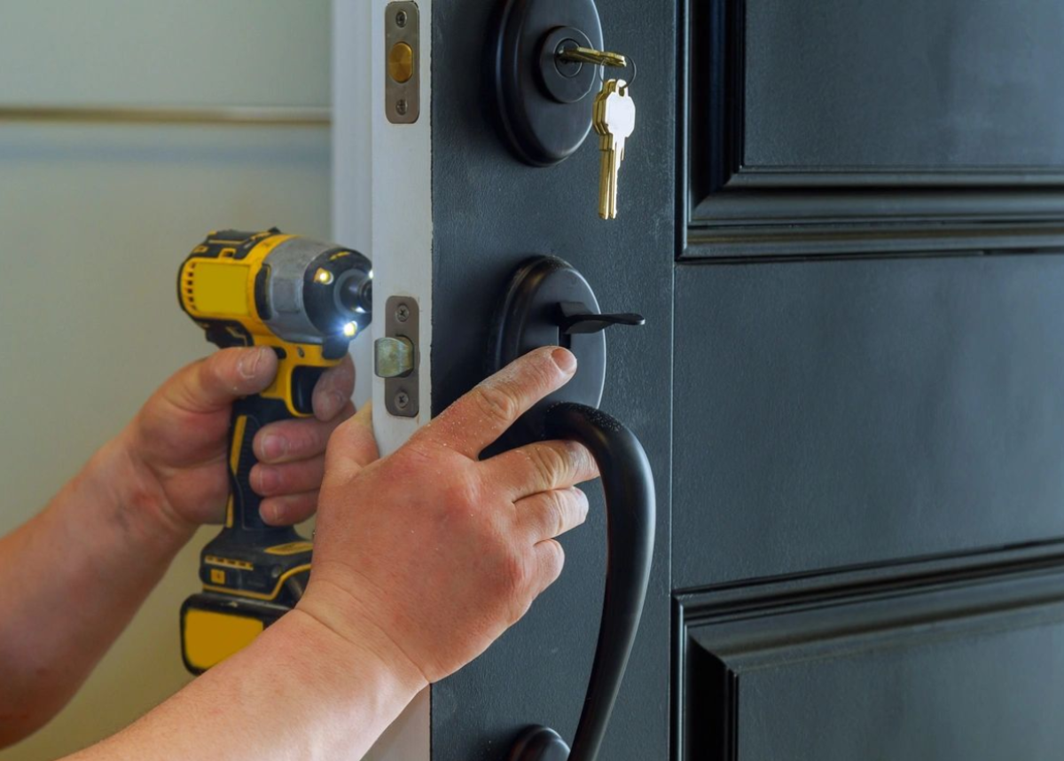 locksmith fixing the door lock